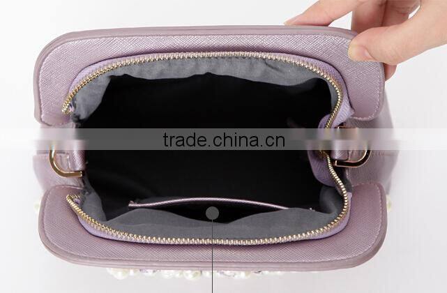 china wholesale latest fashion design decorated with pearl ladies clutch bag