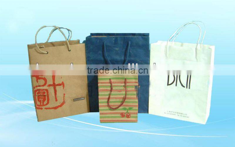 Red shopping paper bags with satin handle