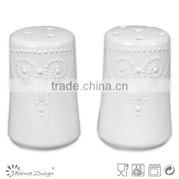ceramic salt and pepper jars embossed round white