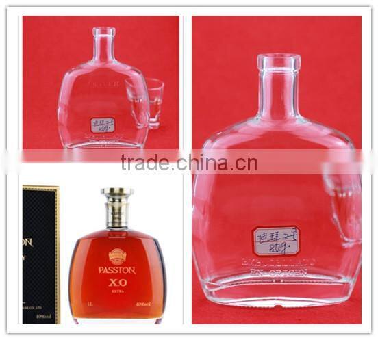 Hot selling cheap embossed spirit bottles glass vodka bottles 700ml french brandy bottle with cork