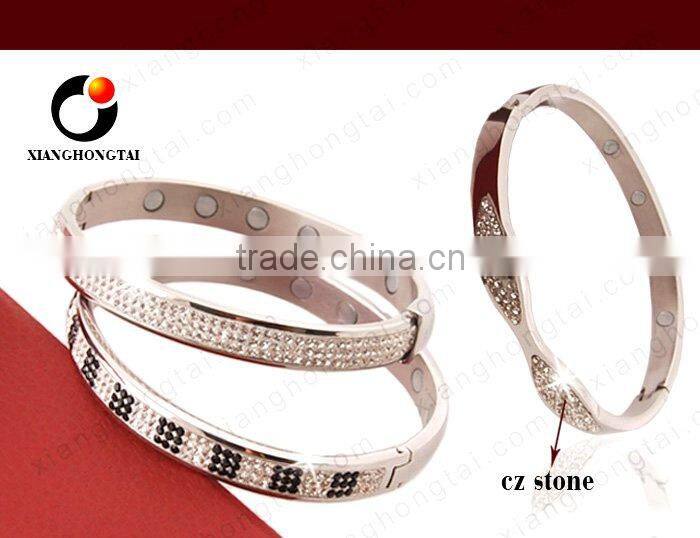 stainless steel bangle with magnets ,we have stocks .
