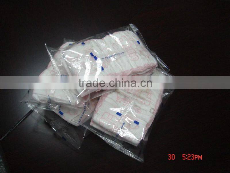 High speed sanitary napkin tissue paper roll packing machine