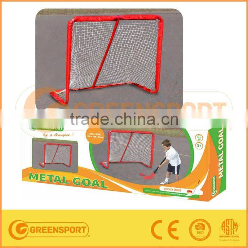 The big Hockey Goal with hockey stick and ball for children playing outdoor with ball and sticks