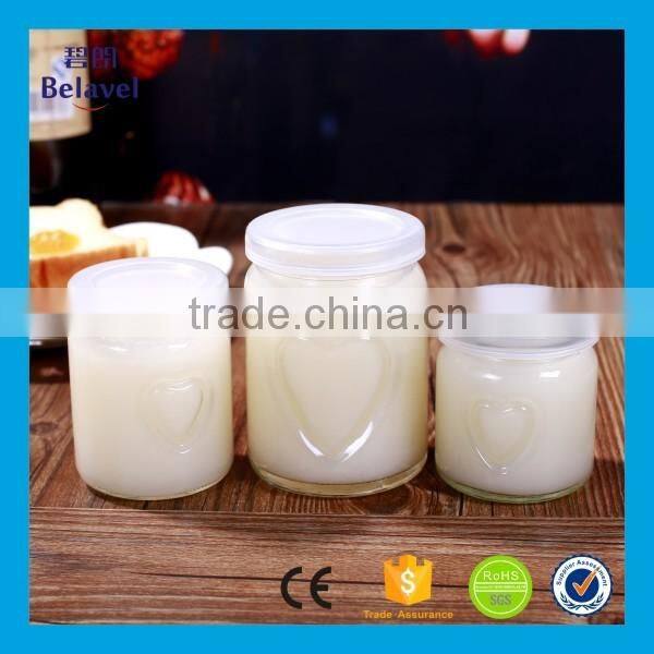 Clear round embossed heart shape glass pudding bottle with plastic cap