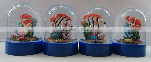 Plastic sea snow globe with boat figurine inner