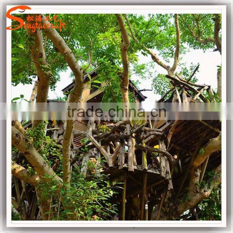 newest design China supplier large outdoor plastic leaves wooden artificial tree house for sale