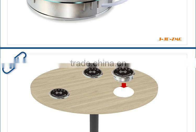New smartphone Qi desktop wireless charger embedded on the furniture table