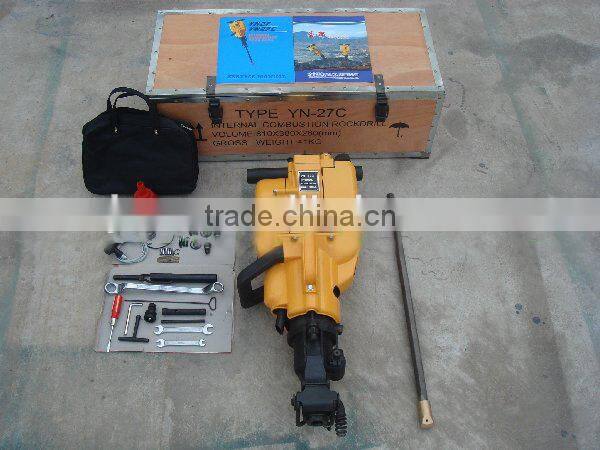 Portable rock drilling machine for rock
