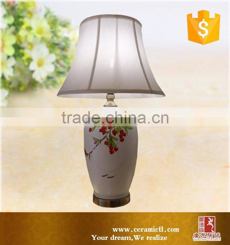 Flower painted white besides table lamps