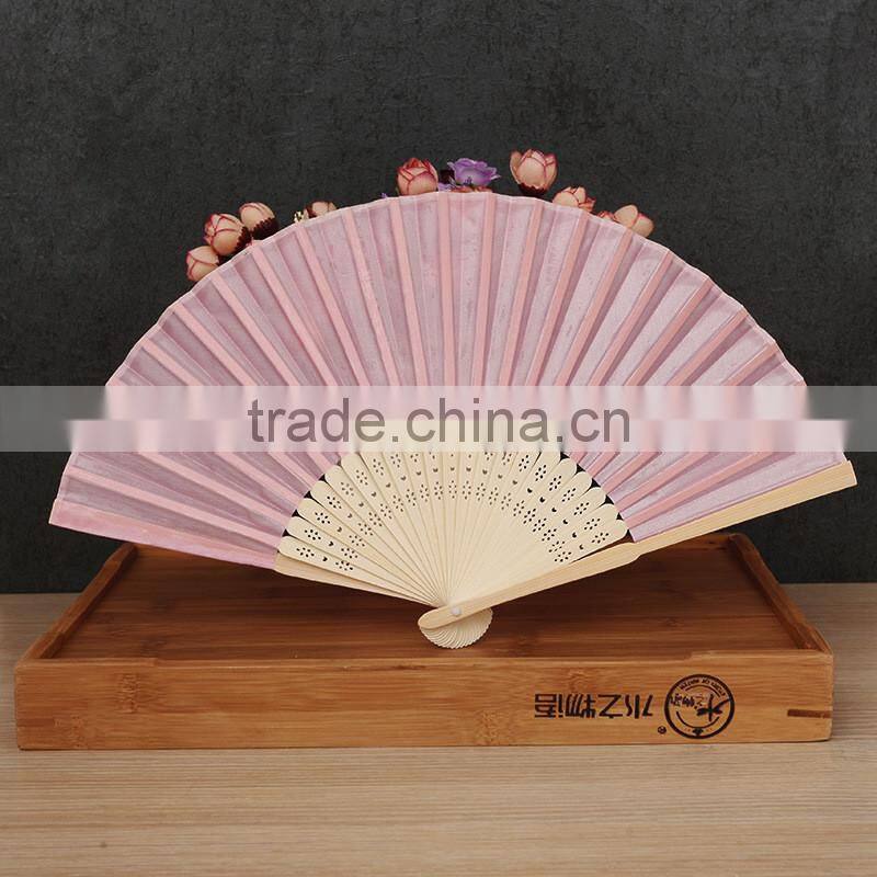 Factory direct bamboo hand fan wedding gift cloth folding hand fan in plain color