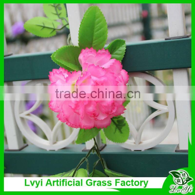 Artificial green leaf vine with flowers for decoration
