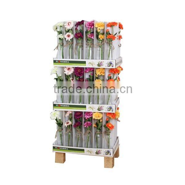white and transparent glass vase with rope decoration and artificial flower