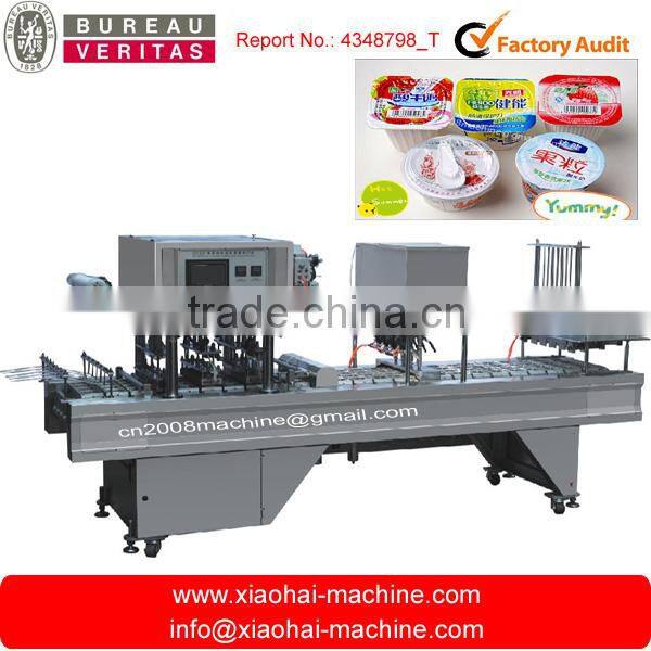 Plastic cup filling and sealing machine