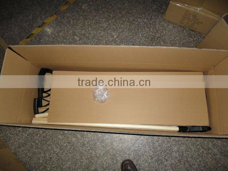 Plastic snow shovel with wood handle