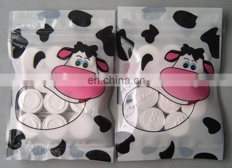 Eco friendly100% rayon material OEM compressed tissue/magic coin hotel napkins/paper roll compressed tablet wipe