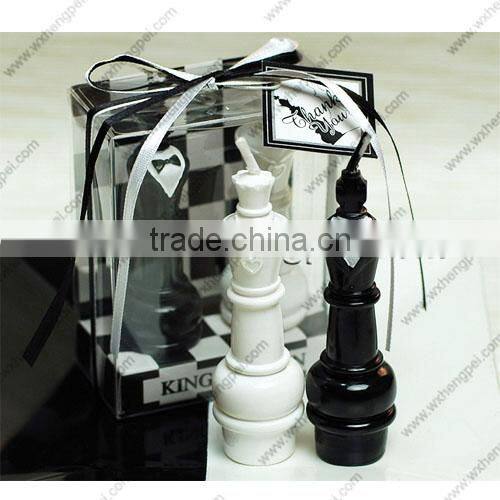 Wedding candles on the chess king and queen