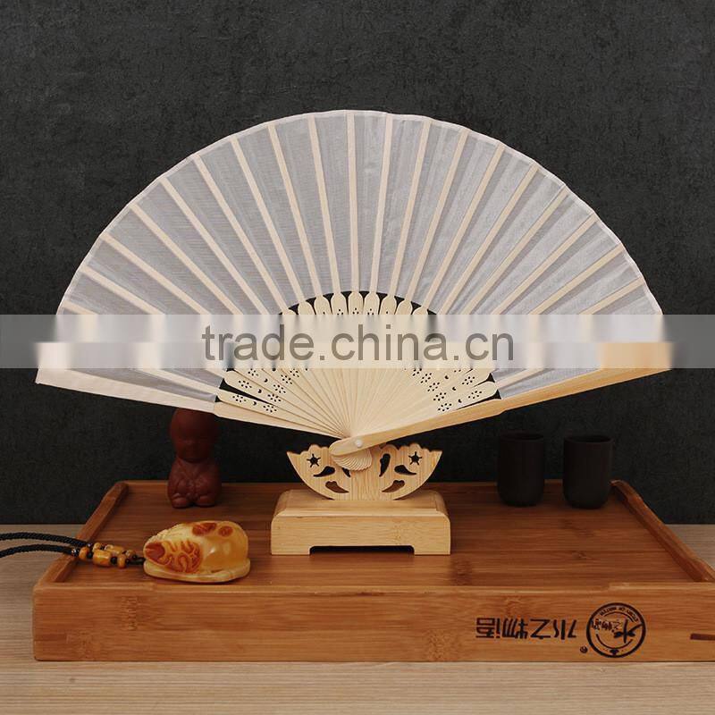 Factory direct bamboo hand fan wedding gift cloth folding hand fan in plain color