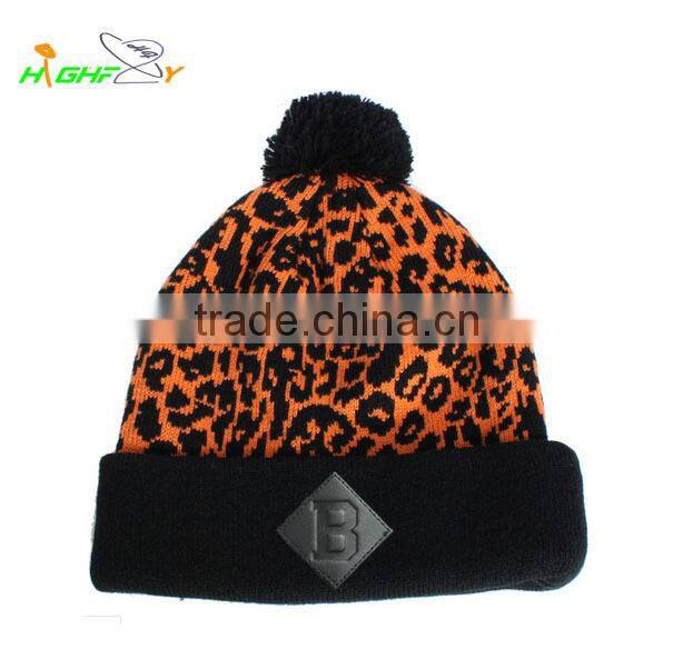 high quality acrylic OEM leopard jacquard knit slouchy pom pom beanie hat with leather patch