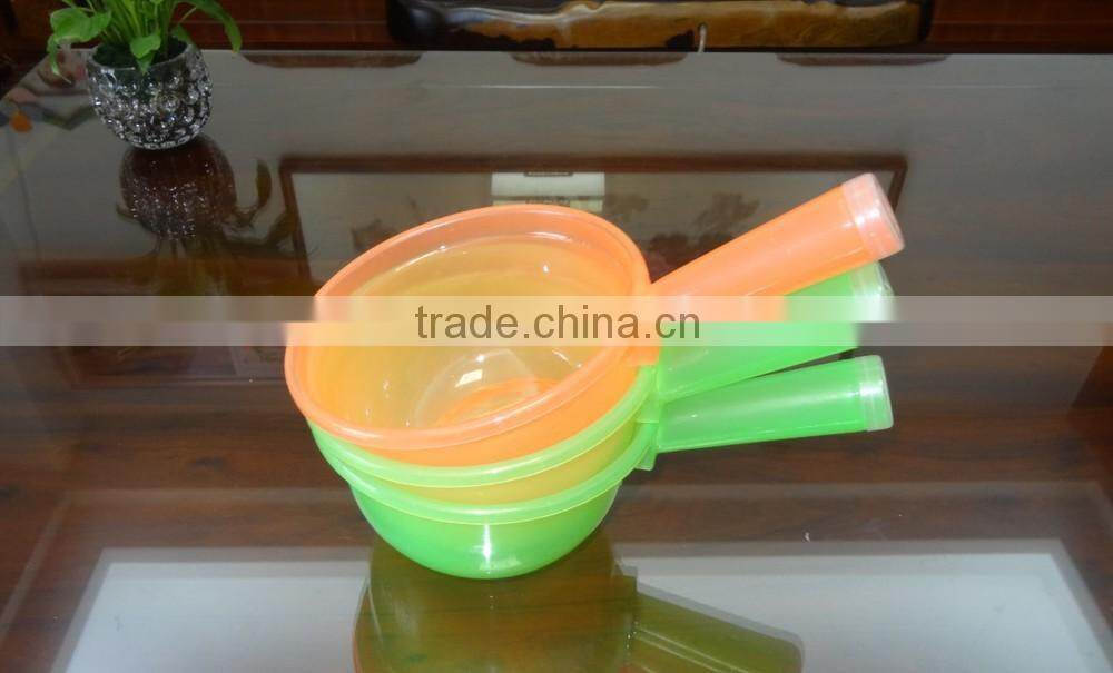 Clear plastic water ladle and soup ladle