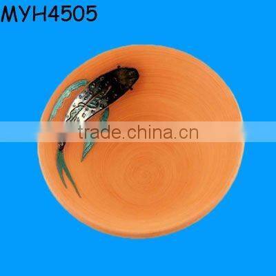 Handmade triple tiered terracotta fruit dish