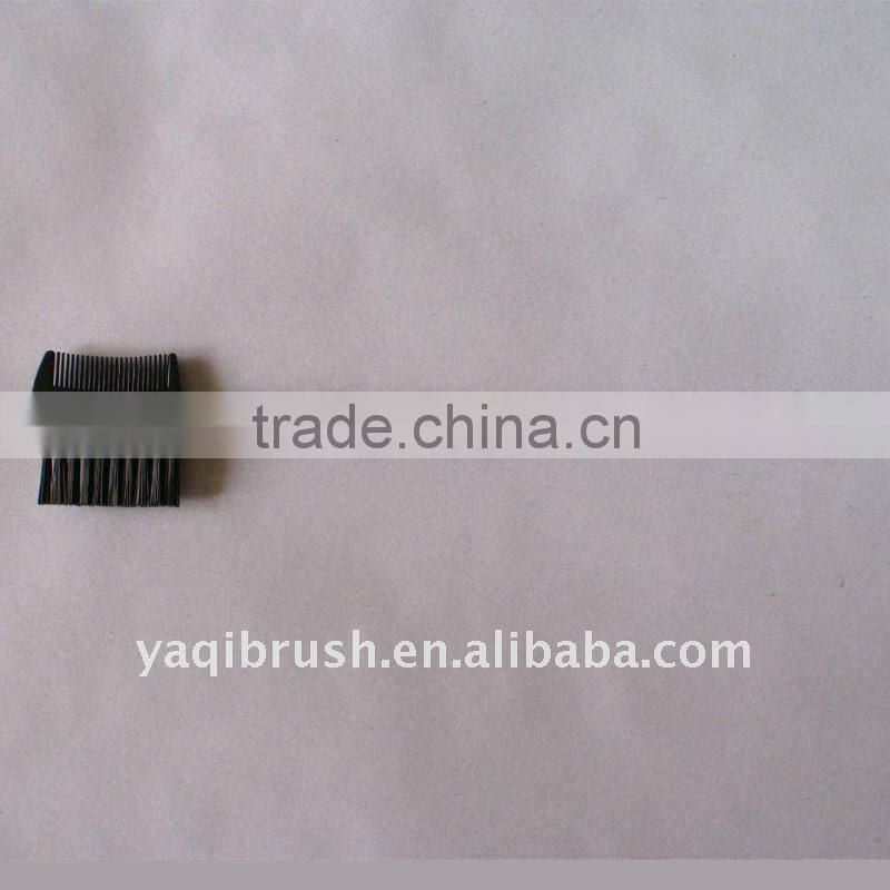 eyebrow comb and lash brush with red handle