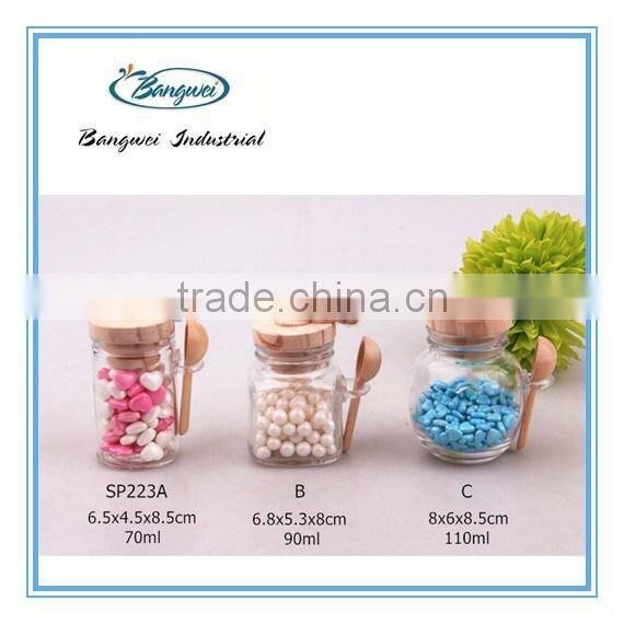 glass spice jar with wooden lid and spoon