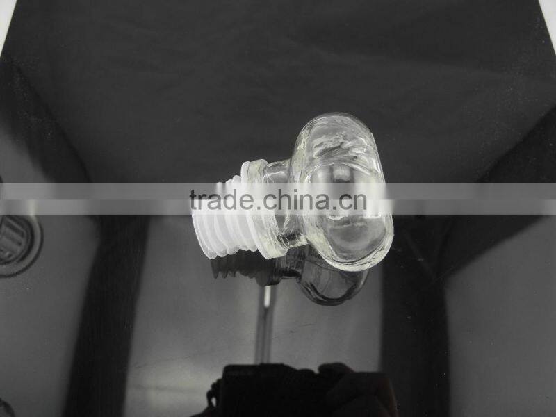 sealed clear glass drinking bottle with glass cork lid