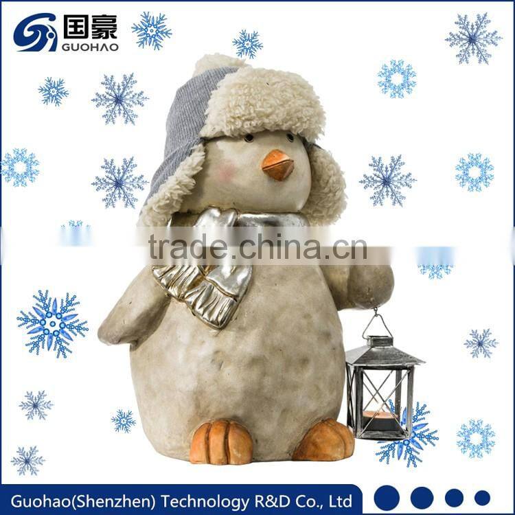 Garden penguin statue with lanterns for Christmas decoration