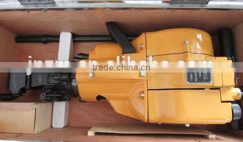 Portable rock drilling machine for rock