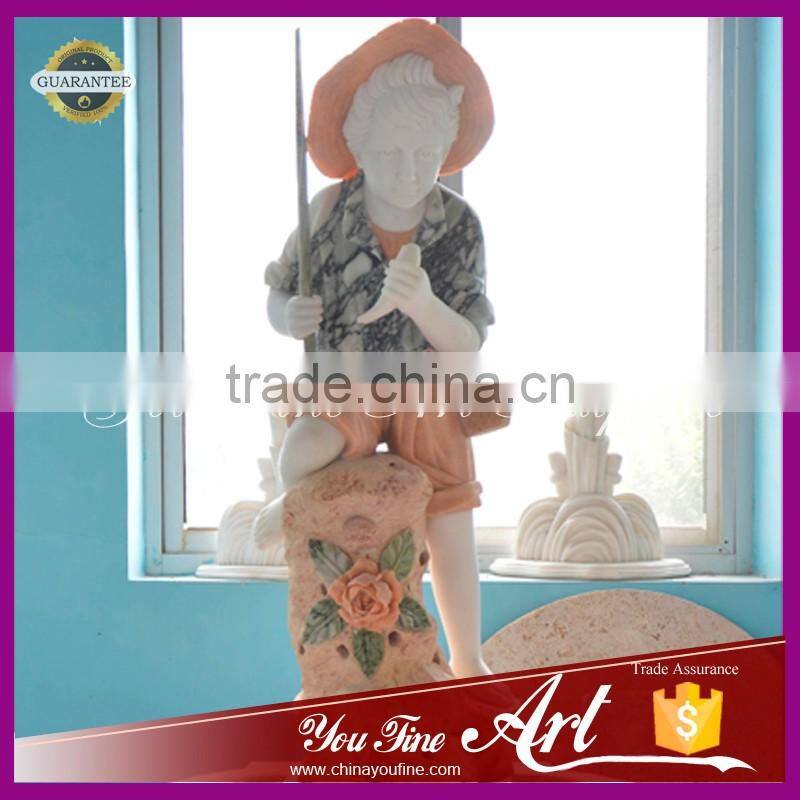 hand carved nature stone fountain with little boy