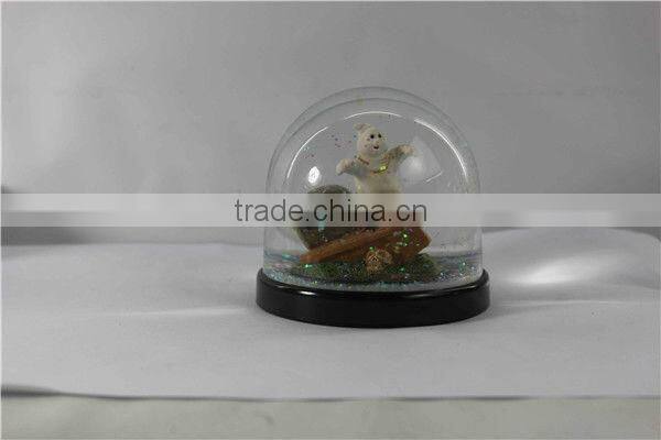 Plastic pumpkin halloween snow globe