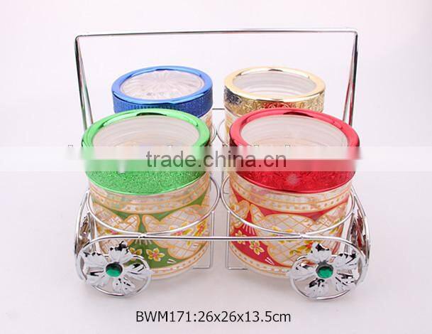 4pcs glass food jar set with colorful decal in a silver rack