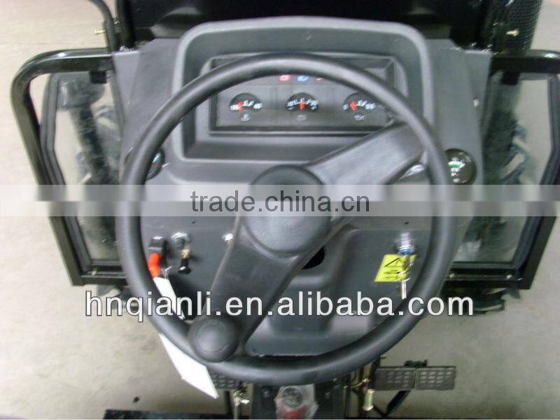 small farm tractor with trailer and front end loader