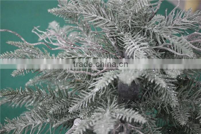 Holy and pure artificial Christmas tree in pot
