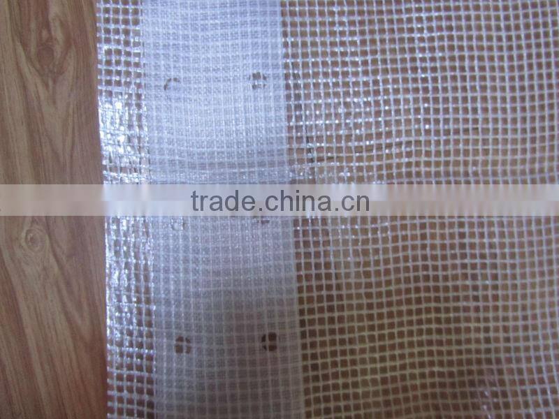 Strong clear or green mesh tarpaulin sheet used for building trade