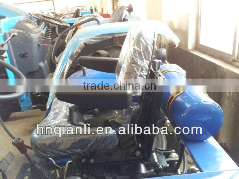 small farm tractor with trailer and front end loader