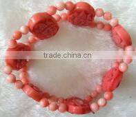 wholesale 7" 15-20mm pink round and carved natural coral beaded bracelet