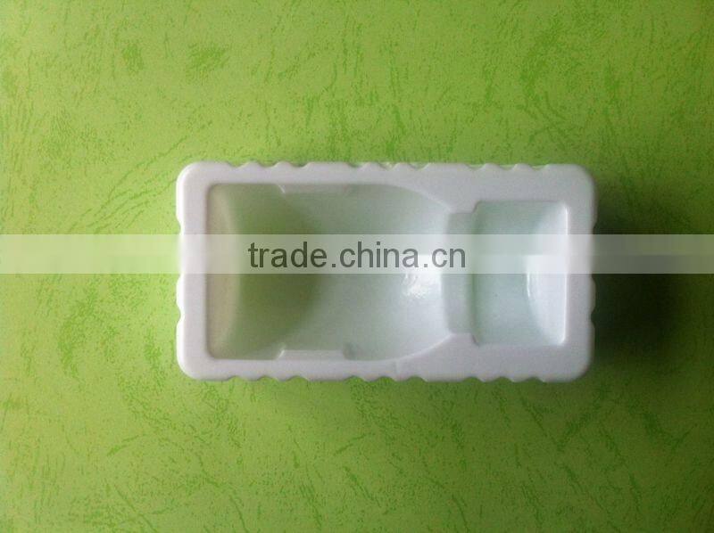 white disposable medical plastic trays, bottle trays
