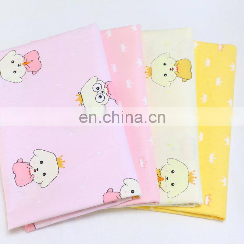Kindergarten baby cloth cartoon dog crown printed cotton twill fabric environment-friendly printing and dyeing fabric