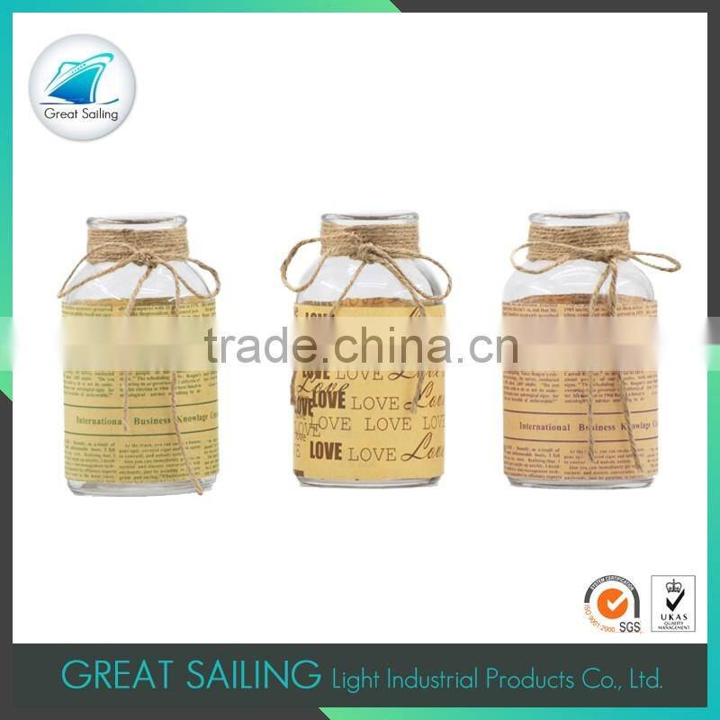 creative mini glass vase centerpiece with newspaper coating