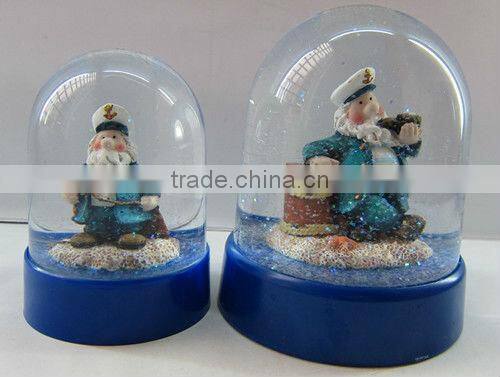 Plastic sea snow globe with boat figurine inner