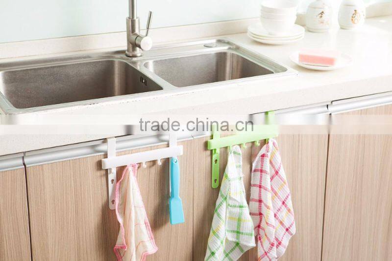 Multipurposed pothook behind the kitchen door