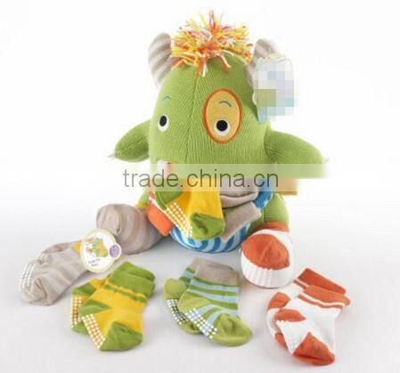 plush monster carrying baby knit socks toy/custom plush toy