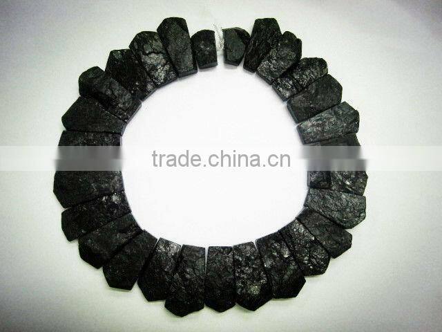 biack tourmaline rough coin