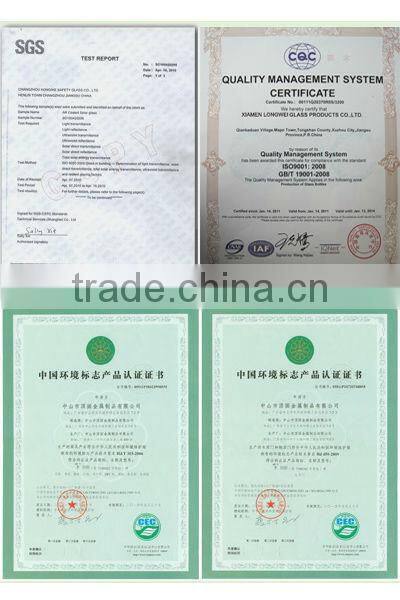 round and square glass bottle with wooden lid