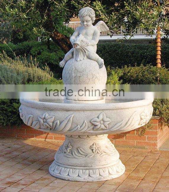 White marble stone garden fountain with cherub