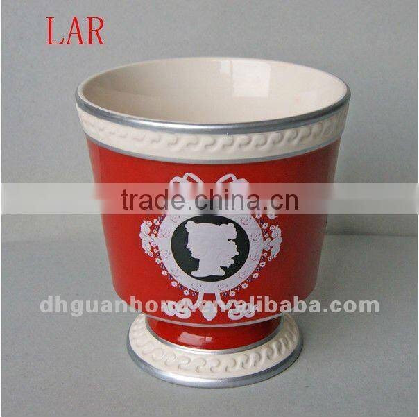 Stock ceramic flower pot in pink color round shape