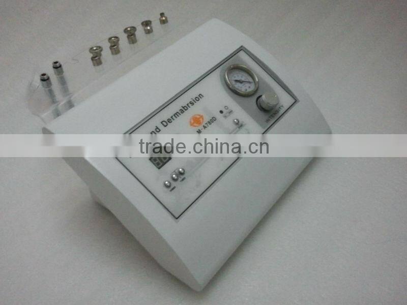 Portable diamond tip microdermabrasion machine