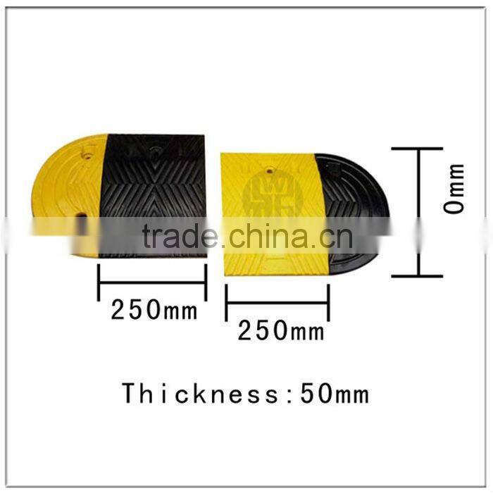 Yellow and black rubber road speed humps