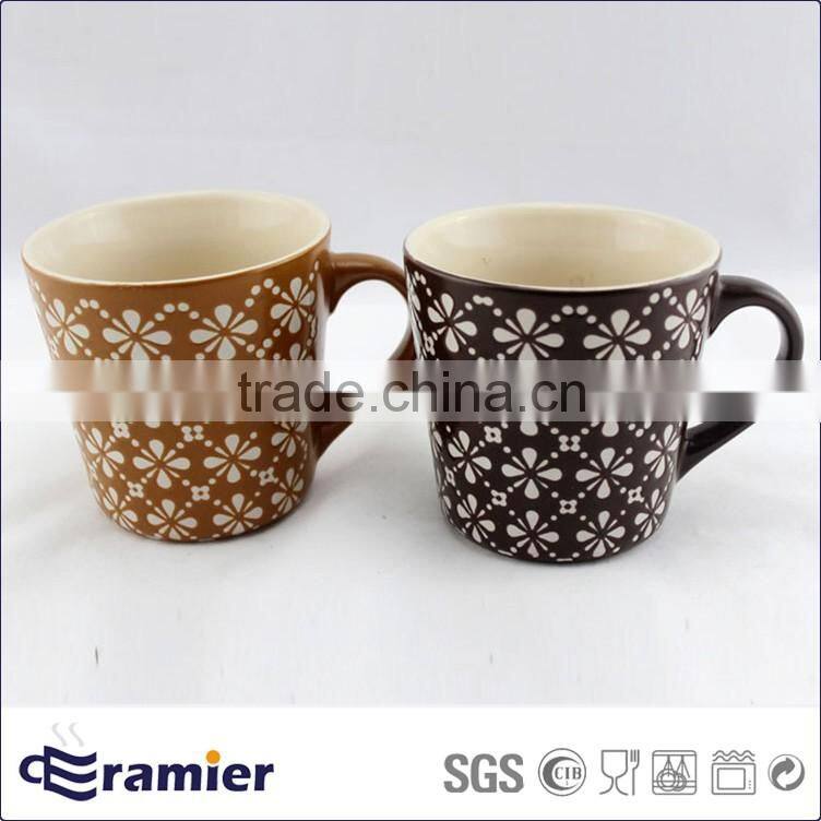 Stoneware conical shaped matte finished cups with handpainted flowers